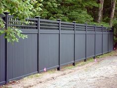 a fence that is in front of some trees