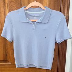 American Eagle Polo Baby Tee Polo Collar, 2 Button Placket Light Blue 60% Cotton, 40% Polyester Size - Medium New With Tags Blue Polo Collar Top With Buttons, Blue Cotton Button-up Polo Shirt, Everyday Tops With Collared Neckline And Button Closure, Everyday Tops With Button Closure And Collared Neckline, Casual Blue Tops With Collared Neckline, Casual Blue Top With Collared Neckline, Blue Cotton Tops With Collared Neckline, Blue Cotton Top With Collared Neckline, Light Blue Cotton Polo Collar Tops