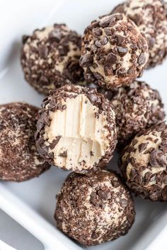 chocolate and peanut butter balls in a white bowl