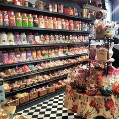 a store filled with lots of candy and candies on display in front of shelves