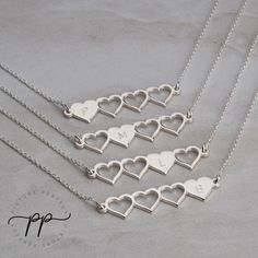 "These four heart initial necklaces make a gorgeous set to share amongst sisters or best friends. The necklaces are designed so that each pendant has one full heart and three cut out hearts, symbolizing the others who share the same necklace set. These jewelry sets help to create and strengthen bonds between friends and sisters. It helps keep people feeling close even when they may geographically be far away from one another. Each pendant can be engraved with any initial of your choice. The engr Best Friend Necklaces For 4 People, Heart Charm Double Heart Necklace For Best Friend, Double Heart Charm Necklace For Best Friend, Heart Charm Double Heart Jewelry For Best Friend, Double Heart Charm Jewelry For Best Friend, Personalized Double Heart Necklace For Best Friend, Sterling Silver Initials Jewelry For Best Friend Gift, Sterling Silver Necklace With Heart Charm For Best Friend, Valentine's Day Initial Pendant Necklace For Best Friend