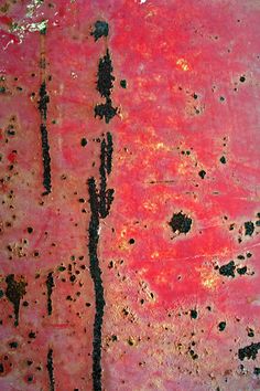 an abstract painting with red and black paint