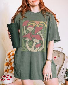 Cute Mushroom Retro Wavy Aesthetic Graphic Tee ️ SIZING & MATERIALS: Printed on Unisex Comfort Colors c1717 garment-dyed t-shirt for a relaxed fit; the fabric brings extra coziness to your wardrobe while the relaxed fit makes it an excellent daily choice.  .: 100% ring-spun cotton .: Medium fabric (6.1 oz/yd² (206.8 g/m *Sizing up 1-2 sizes gives an oversized look* Please compare measurements against our size chart for your perfect fit. Styling ideas - roll up the sleeves, tie a side knot, front tuck, or just wear it as is.  DESIGN/PRINTING: We use DTG (Direct To Garment) Printing which ensures the highest quality of details, color, and durability. *Keep in mind, each shirt is made to order so production and shipping times may vary* Feel free to reach out to us with any questions, includin Aesthetic Graphic Print Tops For Summer, Aesthetic Tops With Graphic Print In Relaxed Fit, Aesthetic Graphic Print Tops For Spring, Aesthetic Graphic Print Top With Relaxed Fit, Aesthetic Relaxed Fit Graphic Print Tops, Aesthetic Relaxed Fit Top With Graphic Print, Aesthetic Cotton Relaxed Fit Tops, Aesthetic Relaxed Fit Cotton Tops, Relaxed Fit Cotton Aesthetic Tops