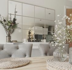 a living room filled with furniture and flowers