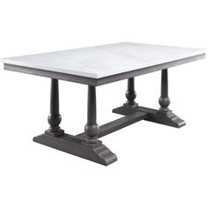 a white table with two black legs and a marble top, on an isolated pedestal