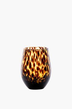 an animal print glass is shown against a white background