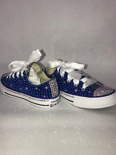 Custom Bling Converse All Star Chuck Taylor Sneakers. All designs handmade and embellished with a variety of high quality crystals. Great for weddings, proms, homecomings, birthdays, special events or just your everyday girly girl. Turn around time is currently 2 - 3  weeks **IF YOU NEED THIS ITEM BEFORE THE PROJECTED SHIPPING TIME YOU MUST CONTACT US BEFORE ORDERING (additional charges may apply) **Shoe Size: Sizes stating at women's size 6 to women's size 12;  Size availability may vary based Dallas Cowboys Bling Converse, Blue Rhinestone Shoes, Bling Clothes, Wedding Crocs, Bedazzled Converse, Rhinestone Converse, Frozen Shoes, Quinceanera Shoes, Marvel Shoes