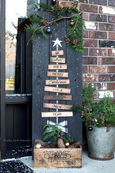 a christmas tree made out of wooden planks sitting on top of a door sill