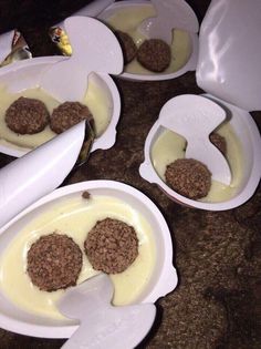 four bowls filled with cheese and meat patties