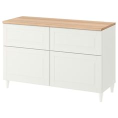 a white cabinet with wooden top and drawers