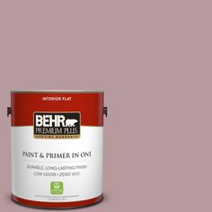 a can of behr paint on a gray background