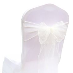 the back of a chair with a white bow on it