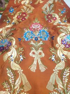 It is butiful jacquard  minakri Banarasi Tibetan Brocade fabric and gold zari woven work and weaving by Handloom Warp- Pure Silk  Weft - Art Silk Extra weft- zari  Width-23 Inch  Length - 8 meters Luxury Banarasi Silk With Chikankari Embroidery, Indian Handloom, Design Fabric, Brocade Fabric, Pure Silk, Fabric Design, Etsy Accessories, Weaving, Accessory Gift