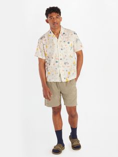 When the summer heat is coming in hot, button up with the laid-back vibes of the Muir Camp shirt. Your new go-to collared shirt for summer mountain fun can now make a splash at the pool and cocktail party. Flex your vintage prowess with a timeless, eye-catching camp collar without losing sight of your adventurous side. Updated with a recycled polyester ripstop and cotton blend, this collared short sleeve gives you soft, breathable durability so you're trail and campsite ready for many trips to come. Dress it up for a night on the town or unwind at the lake after a hot summer hike. | Marmot Men's Muir Camp Collar Novelty Short Sleeve Shirt in Papyrus Trail Mix Size: Medium Vacation Short Sleeve Shirt With Camp Collar And Pockets, Collared Camp Shirt With Pockets For Summer, Summer White Camp Shirt With Pockets, White Summer Camp Shirt With Pockets, Collared Hawaiian Shirt With Pockets For Summer, Summer Collared Hawaiian Shirt With Pockets, Summer Shirt With Relaxed Fit And Camp Collar, Vacation Shirt With Johnny Collar And Button Closure, Relaxed Fit Button-up Shirt For Summer