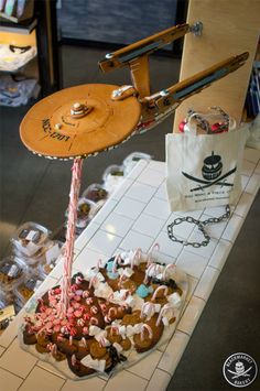 a table topped with lots of different types of candies and other items on top of it