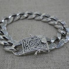 "Sterling Silver Celtic Curb Link Bracelet Size 7\", 7.5\" or 8\" Size 7\" In stock Ships immediately. Size 7.5\" Ships in 3 to 5 days. Size 8 In Stock Ships Immediately. Celtic Design on tongue and groove clasp with safety latches. Celtic Closure 20 mm long x 12.5 mm wid. Celtic Knots on links. Links 11 mm wide. Nicely boxed with a silver cloth. Dragon Weave Bracelet by Keith Jack Imported from Canada Signed by the Artist" Rectangular Chain Bracelet With Box Clasp As Gift, Rectangular Bracelet With Box Clasp As Gift, Rectangular Bracelet With Box Clasp For Gift, Rectangular Hallmarked Chain Bracelet As A Gift, Rectangular Bracelet With Sterling Silver Clasp Gift, Weave Bracelet, Celtic Knot Ring, Celtic Wedding Rings, Closure Design