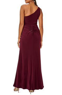 Steal the show anywhere you go in this jersey gown topped by a dainty one-shoulder neck and finished with a drapey detail. 60" length (size 8) One-shoulder neck Lined 95% polyester, 5% elastane Dry clean Imported Ruched One Shoulder Floor-length Dress For Gala, Ruched One-shoulder Floor-length Dress For Gala, Floor-length Ruched One Shoulder Dress For Gala, Floor-length Ruched One Shoulder Prom Dress, Ruched One-shoulder Floor-length Prom Dress, Asymmetrical Neckline Ruched Maxi Dress For Prom, Elegant One Shoulder Elastane Dress For Evening, Elegant One-shoulder Elastane Evening Dress, Elegant One Shoulder Elastane Evening Dress