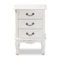 a white chest of drawers sitting on top of a table