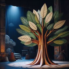 a stage set with a tree on the floor