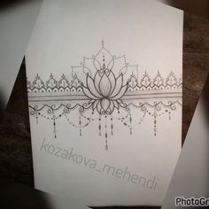 a drawing of a lotus flower on top of a piece of paper with the words kozaka mehendi written below it