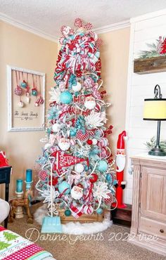 a christmas tree decorated with red, white and blue ornaments