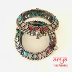 Multicolor Ethnic Silver Oxidized Bracelet/ Ethnic Bracelet /Boho Jewelry/Ethnic Oxidized Silver Bracelet Kada- Available Size: 2.4. Can fit size 2.6 due to openable feature.- Silver Oxidized Bracelet with simulated stones and stones in silver finish.- Very Elegant and stylish, this bracelet can be paired with any Attire depending upon the occasion and the theme. - The base is pure brass (90%) and pure 92.5 silver (10%) which makes this very sturdy and of good quality. - 100% guarantee on the po Multicolor Fusion Bracelets, Traditional Multicolor Bracelets For Festivals, Traditional Multicolor Festival Bracelets, Bohemian Multicolor Tilla Bangle, Vintage Multicolor Bracelets For Festive Occasions, Multicolor Festival Bangle Bracelet, Bohemian Multicolor Round Bangle, Traditional Adjustable Multicolor Bangle, Fusion Style Multicolor Bangle For Festive Occasion