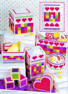 a group of colorful boxes with hearts on them and other items in front of it