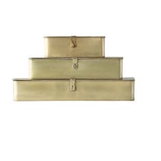 three gold suitcases stacked on top of each other in the shape of a pyramid