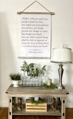 a wooden table with plants on it and a framed quote above the top that says, for i am grateful