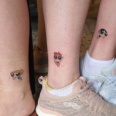 three people with matching tattoos on their legs, one is wearing a pair of sneakers