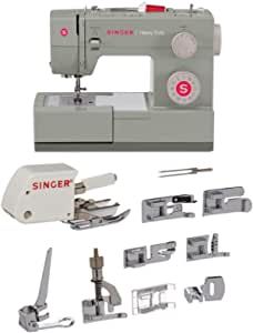 the singer heavy duty sewing machine is set up with all its attachments and tools