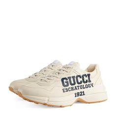 The Only Chunky Sneakers You Need In Your Repertoire. Editor’s Note After Debuting In The Cruise 2018 Collection, Gucci’s Rhyton Sneakers Have Become Firm Favourites Of Longtime Fans And Streetwear Aficionados Alike Perhaps Due To Their Balance Of Retro Appeal And Sleek Sophistication. Kept Minimal Except For The Brand’s New-Season Eschatology Motif To One Side And 25 To The Other, This Leather Pair Is Ideal For Layering Beneath A Wealth Of Off-Duty Ensembles. Gucci High-top Sneakers With Logo Print, Sporty Gucci Sneakers With Logo Print, Gucci Sneakers With Logo Detail For Sports, Gucci High Top Sneakers, Gucci High Tops, Gucci Rhyton, Shoe Basket, Green Trainers, Red Trainers