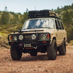 an off - road vehicle is parked in the dirt