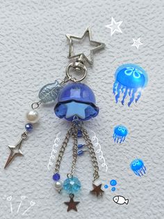 a keychain with jellyfish and stars on it