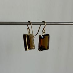 Distinguished facets join forces with a deep amber color in these elegant quartz earrings. 18k yellow gold Quartz 12mm x 16mm (1/2" x 5/8")Earrings hang 1 1/8" from the ear Each earring weighs 3g Modern Octagon Earrings For Formal Occasions, Gold Faceted Earrings For Evening, Elegant Formal Citrine Earrings, Formal Amber Citrine Earrings, Classic Brown Jewelry With Matching Earrings, Classic Amber Earrings For Formal Occasions, Classic Faceted Yellow Gold Earrings, Classic Faceted 14k Gold Earrings, Classic 14k Gold Faceted Earrings