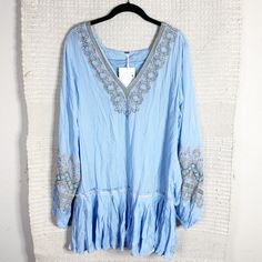 Free People Wild One Dress In Blue Skies. Light Blue With Orange And Green Embroidery. V-Neck. Long Billowy Sleeves. Ruffled Hem. Tunic Silhouette. Mini Length. Measurements: 19.5” Bust, 20” Waist, 32.5” Length Material: No Tag Condition: Brand New With Tags. No Flaws. Spring, Summer, Vacation, Beach, Cruise, Casual, Fall, Winter, Formal, Wedding Guest, Cocktails, Gala, Thanksgiving, Christmas, Holidays, Party, Birthday, Bachelorette, Going Out, Date Night, Valentine's Day, Bridal Shower, Bachel Blue Boho Tunic Dress For Spring, Long Sleeve Dress With Embroidered Hem For Vacation, Summer Long Sleeve Boho Dress With Embroidered Hem, Long Sleeve Mini Dress With Embroidered Hem For Summer, Long Sleeve Boho Dress With Embroidered Hem For Summer, Blue Long Sleeve Boho Dress For Summer, Blue Long Sleeve Boho Dress For Spring, Long Sleeve Blue Boho Dress For Spring, Long Sleeve Dresses With Embroidered Hem For Festival