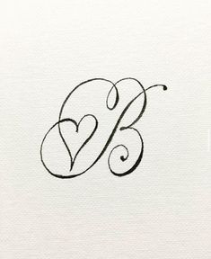 the letter b is written in cursive writing and has a heart on it