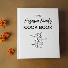 the ferguson family cook book sits next to some dried flowers