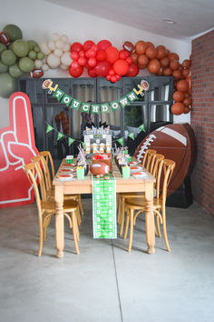 a football themed party with balloons and decorations