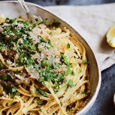 a bowl filled with pasta and parmesan cheese