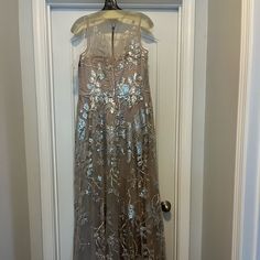 This Is A Gorgeous Ricki Freiman Dress For Terri John. New With Tags. Champagne Color With Silver Sequin Overlay. You Can Find This Brand In Saks, Neiman Marcus, Nordstrom. Elegant Metallic Floor-length Dresses, Elegant Floor-length Metallic Dresses, Silver Dress For Wedding And Prom Season, Champagne Sleeveless Mother Of The Bride Dress For Evening, Festive Champagne Gown, Metallic Floor-length Sequined Dress, Silver Sleeveless Maxi Dress For Gala, Silver Sleeveless Party Gown, Metallic Floor-length Evening Dress For Wedding