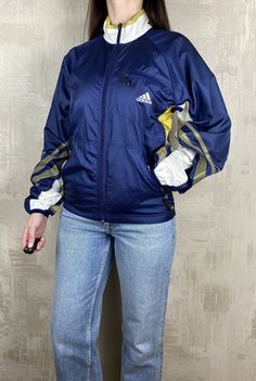 Adidas Equipment Vintage 90's Windbreaker Women's Track Jacket  Size: XS Excellent condition, no spots and holes Measurements: - armpit to armpit                        48 cm (18,89 inch) - length                                       79 cm (31,10 inch) - sleeve length from throat         79 cm (31,10 inch) - armpit to cuff                            56 cm (22,04 inch) Worldwide shipping 90s Nylon Track Jacket For Fall, 90s Style Nylon Track Jacket For Fall, 90s Style Long Sleeve Windbreaker For Fall, 90s Style Long Sleeve Fall Windbreaker, Vintage Windbreaker For Fall Sports, 90s Style Long Sleeve Track Jacket With Pockets, 90s Style Long Sleeve Track Jacket For Fall, 90s Style Track Jacket For Fall Outdoor, 90s Style Sports Windbreaker For Fall