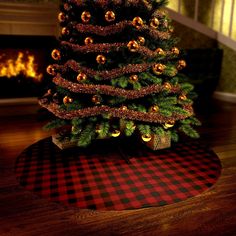 a small christmas tree on top of a rug