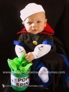 a baby dressed as pope pimpine sitting in a bucket