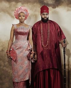 a man and woman dressed in traditional african clothing