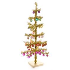 a small christmas tree with ornaments on it