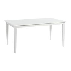 a white table sitting on top of a white floor