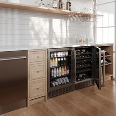 a wine cooler in the middle of a kitchen