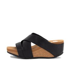 Our CHELA slide sandal features a modern wedge and chic upper that can be dressed up or down. The lightweight cork wedge, crafted with our Signature Yellow Box EVA, offers the feel of a flip-flop, making it ideal for all-day wear. Toe: square Heel Height: 2.75 inches Platform Height: 1.25 inches Materials: faux leather Insole: Signature Yellow Box EVA Outsole: rubber Chic Wedge Sandals With 4-inch Heel And Medium Width, Modern Synthetic Wedge Sandals With 4-inch Heel, Shoes For Fall, Modern Black Wedge Sandals With 4-inch Heel, Black Wedge Sandals With Cork-bed Midsoles, Synthetic Slip-on Wedge Sandals With Textured Sole, Black Wedge Sandals, Wedge Sandal, Cork Wedge