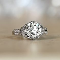 an oval cut diamond ring on a table